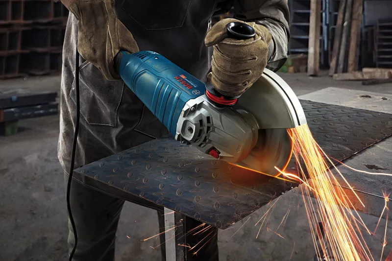 Cutting steel with angle grinder.