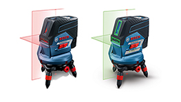 Zwei Bosch Professional Laser-Einheiten mit roten und grünen Linien, auf einem Tisch.