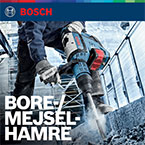 En Bosch Professional bore-/mejselhammere i brug på beton, med en arbejder iført sikkerhedsudstyr.