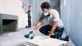 Bosch GDC 140 diamond tile cutter in use.