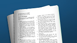 Un document avec des lignes de texte sur fond bleu, flou en haut à gauche.