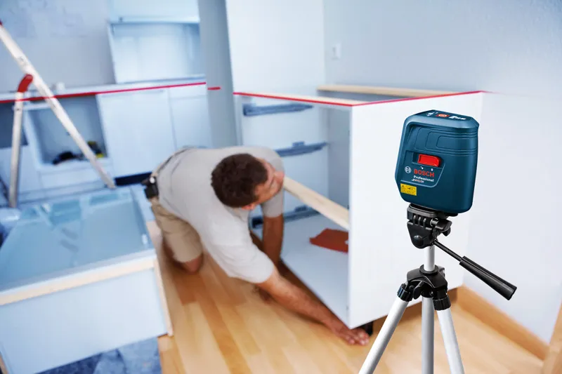 Laser level aligns cabinets.