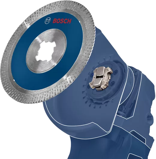 Angle grinder with attached diamond saw blade shown in close-up for cutting applications.