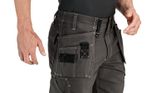 Person wearing grey shorts with holster pockets and visible stitching.