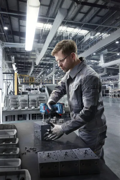 Bosch ISR 18V-30 PHX impact wrench in industrial use.