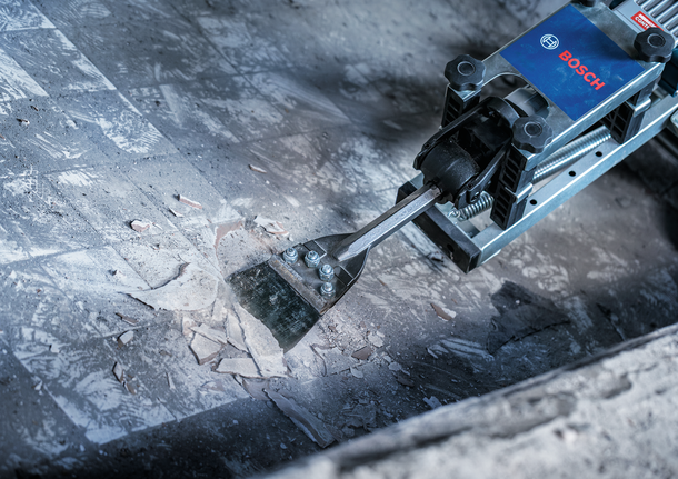 Bosch PRO HEX 28 Floor Scraper removing tile adhesive.