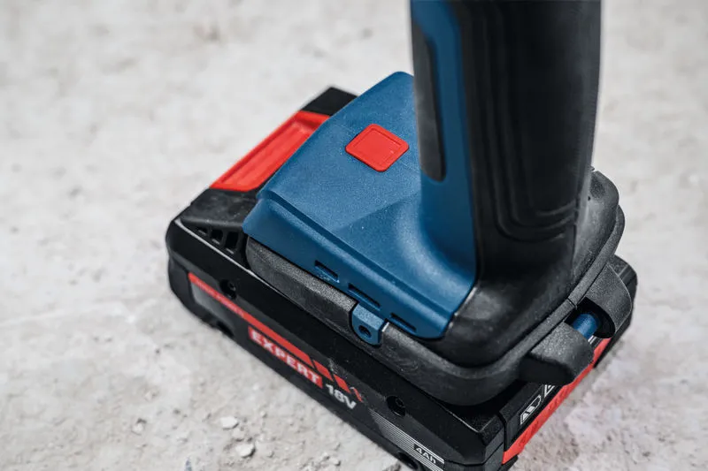 Cordless pipe shear placed on a concrete surface.