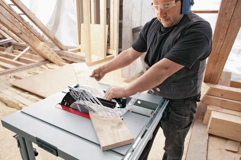 Table saw cutting wood.