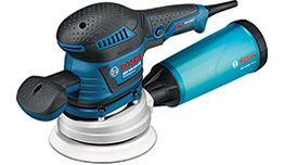 A blue Bosch Professional orbital sander with a white sanding disc, on a neutral background.