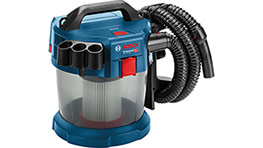 A blue Bosch Professional vacuum cleaner with a clear container and attached hose.