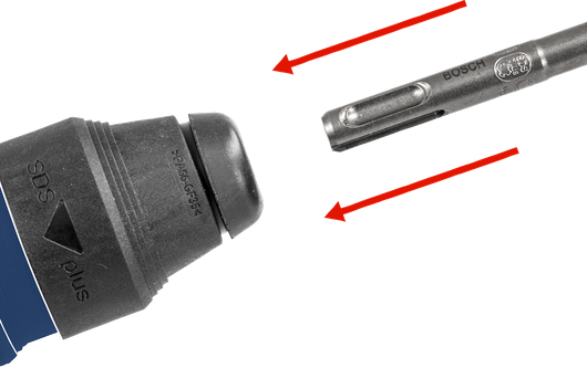 Drill bit positioned near a power tool chuck, ready for attachment.