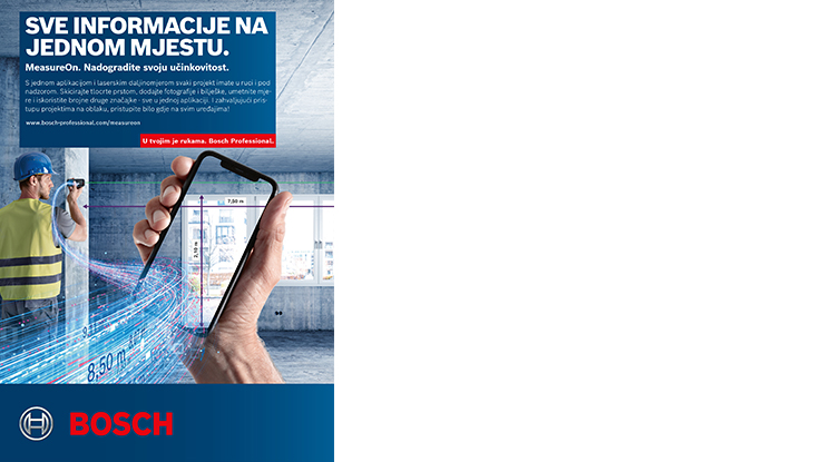 Muškarac u žutom prsluku drži pametni telefon, mjeri visinu u građevinskom prostoru.