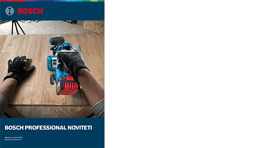 Ruka s rukavicama drži plavi Bosch Profesional alat na drvenoj površini.