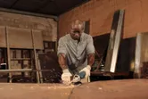 Man grinding metal sparks.