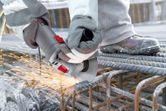 Bosch WS700 angle grinder cutting steel rebar.