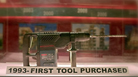 A model tool displayed in a case, labeled '1993: FIRST TOOL PURCHASED'.