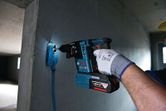 Bosch GBH 18V-26 F cordless rotary hammer in use.