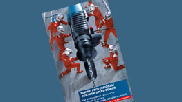 Un trapano Bosch Professional con operai in tuta rossa sullo sfondo.