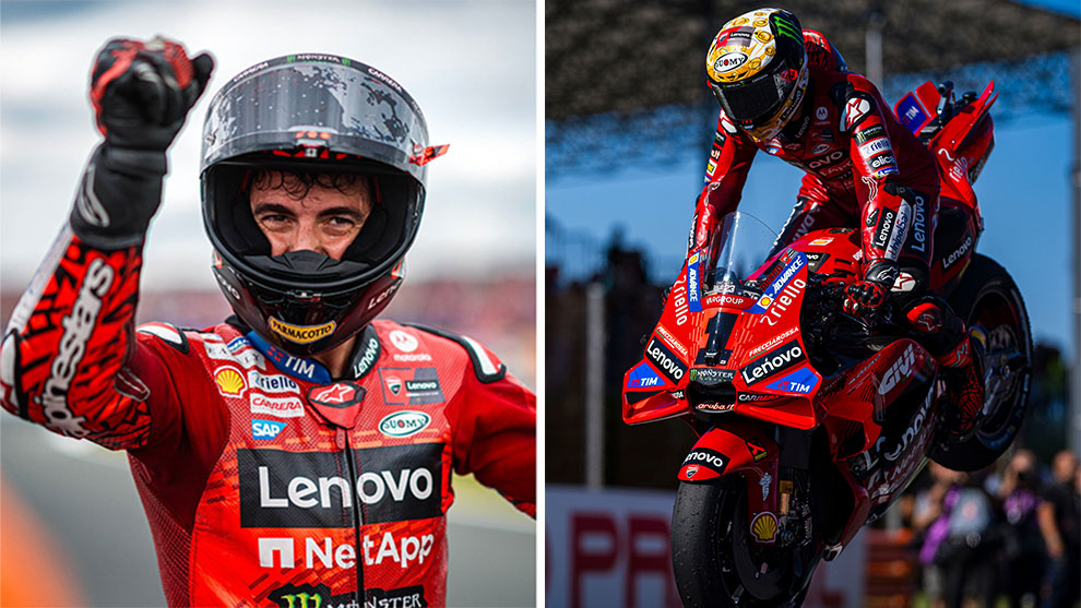Un pilota in tuta rossa Lenovo alza il pugno, moto rossa in azione sul circuito.