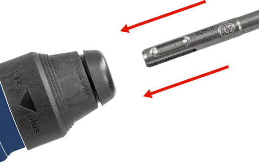 Drill bit positioned near a power tool chuck, ready for attachment.