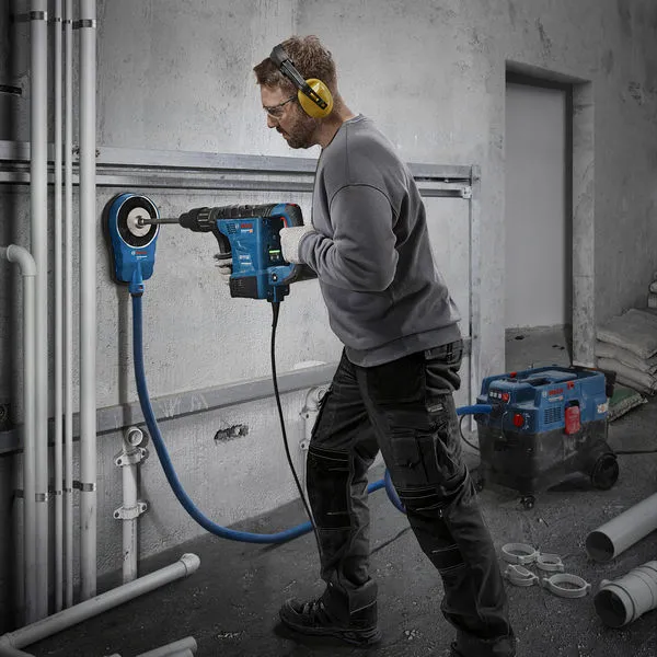 Bosch GBH6-42VB rotary hammer drilling wall.