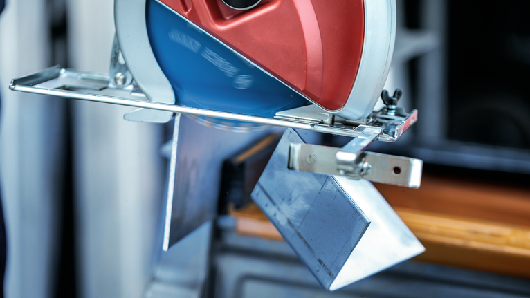 Circular saw making a precise cut through a metal sheet.