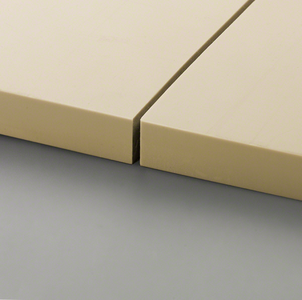 Two beige tiles are precisely cut and placed closely together.