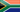 A South African flag with colorful stripes and a black triangle.