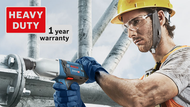 A worker wearing a hard hat is using a blue Bosch Professional cordless screwdriver.