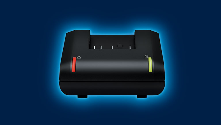 Black Bosch Professional charging station with red and green light.