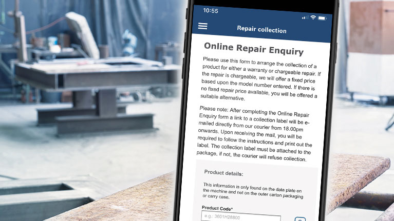 A smartphone shows an online repair request in a workshop.