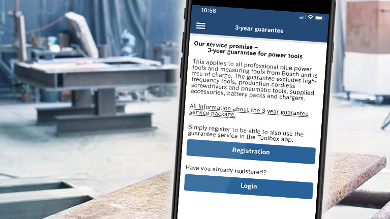 Smartphone displays Bosch warranty information in workshop environment.
