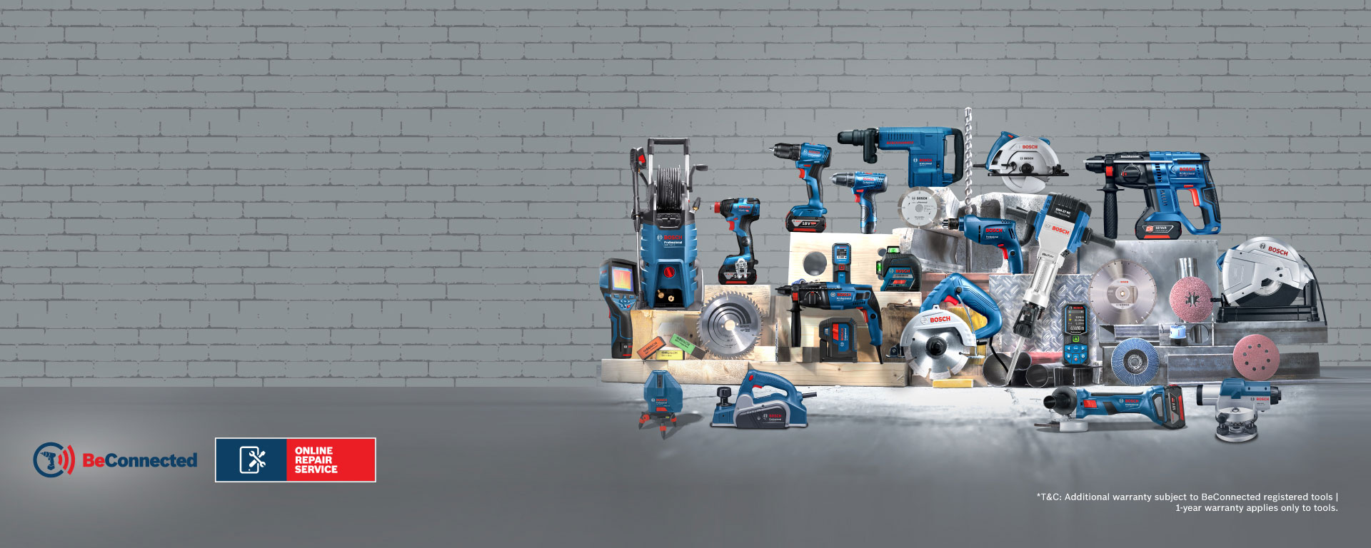 Various blue Bosch Professional tools arranged on wooden boards.