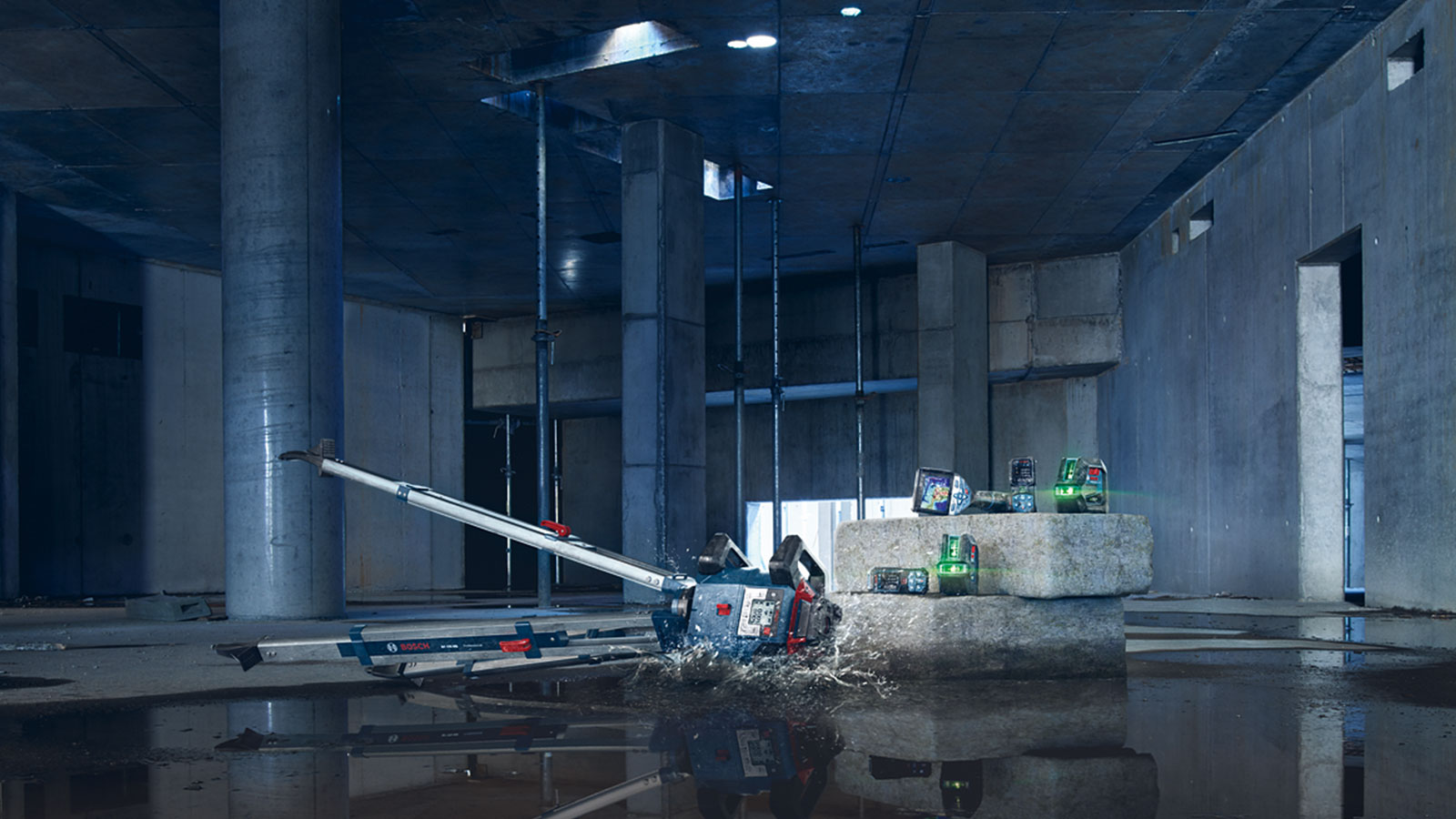 Bosch Professional tools on a concrete block at a construction site.