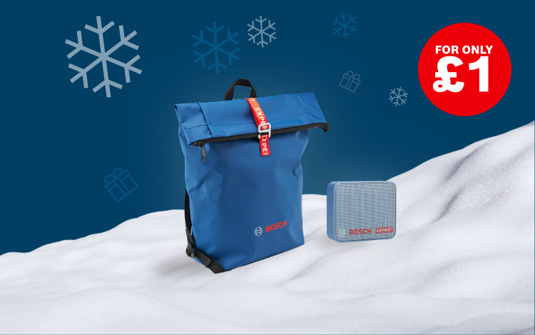 A blue, foldable bag with a red handle and a gray tool set are placed on a white snow blanket. In the background, there are white snowflakes and a red price tag that says "FOR ONLY £1".
