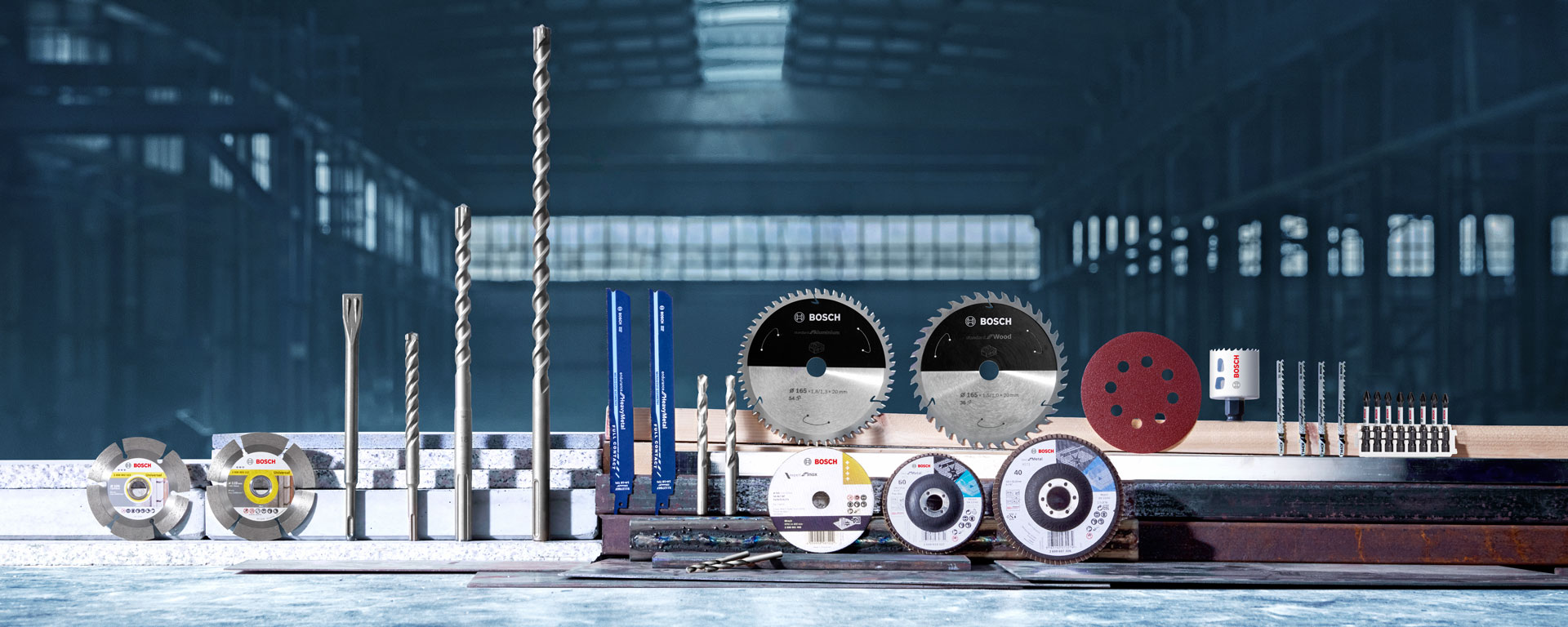 Bosch Professional tools on a work surface, various drills and saw blades.