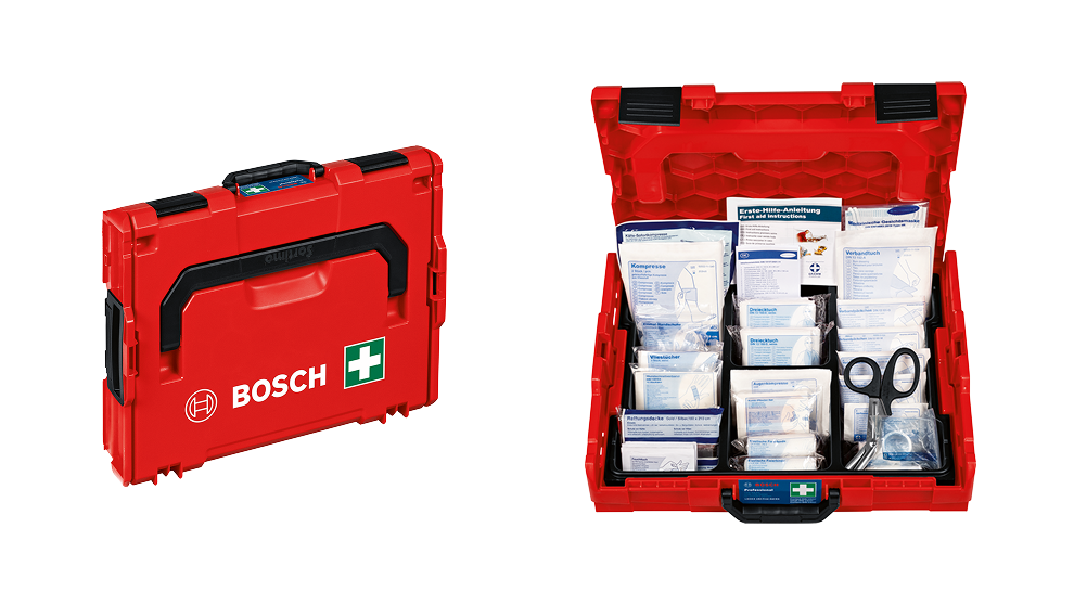 Boîte de premiers secours rouge Bosch ouverte avec du matériel de bandage et des ciseaux.