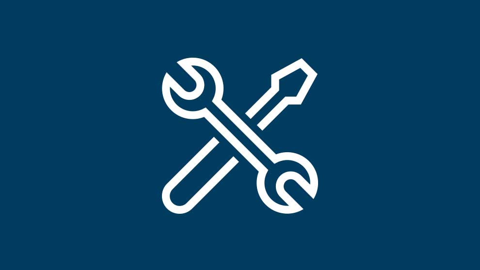 Weißes Werkzeug-Symbol auf dunkelblauem Hintergrund.