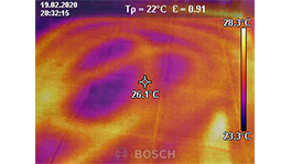 Thermografische afbeelding toont temperatuurverdeling in oranje en paarse tinten.