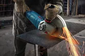 Cutting steel with angle grinder.