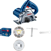 Bosch GDC 140 marble cutter with blades and wrench.