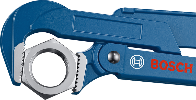 Blue adjustable wrench gripping a large hexagonal nut.
