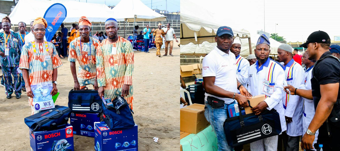 Men in colorful outfits hold Bosch tools at an outdoor event. Tents in background.