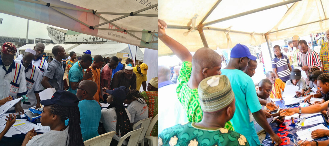 A crowded outdoor event with people at tables filling out forms under a tent.