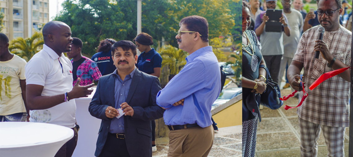 Bosch event with people discussing and a man cutting a red ribbon outdoors.