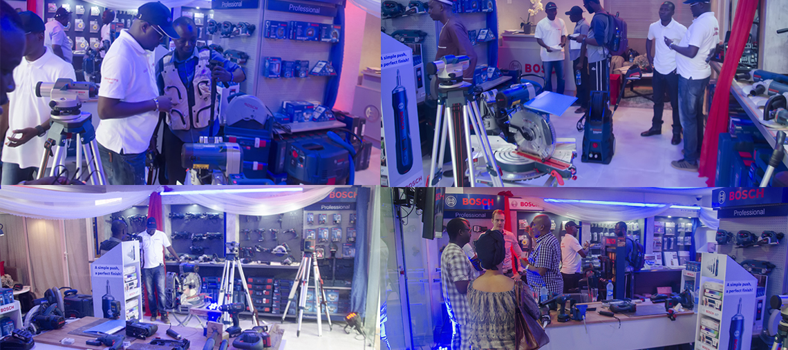 Bosch Professional tools displayed; people engage and examine equipment in a bright shop.