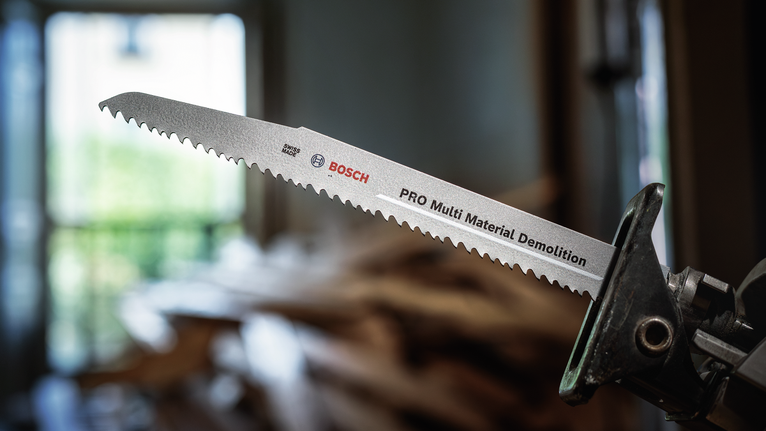 PRO Multi Material Demolition S1210VF Blade, 1.6 x 22 x 300 mm, 5 pcs Reciprocating saw with a demolition blade ready for cutting indoors.