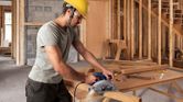 Man using circular saw.