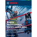 En person i skyddskläder står vid en vägg med rör och håller i en Bosch Professional verktyg.