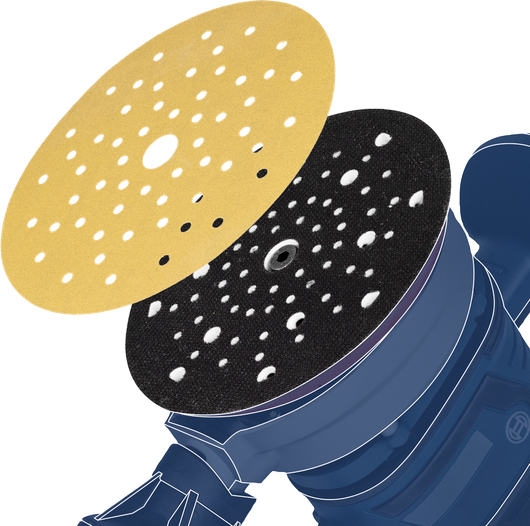 Sanding disc being aligned onto a round power tool pad.